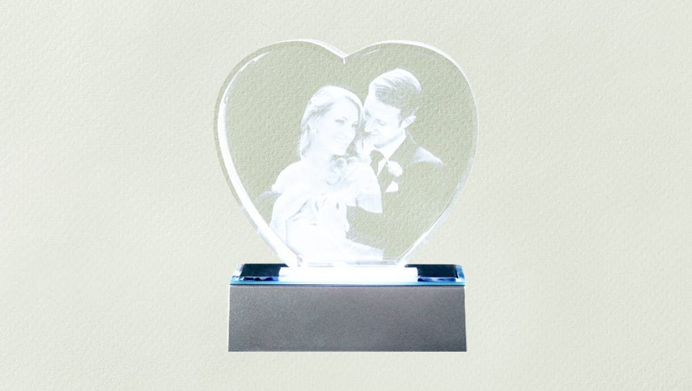 Heart-shaped crystal featuring a photo of a couple, symbolizing love and cherished memories.