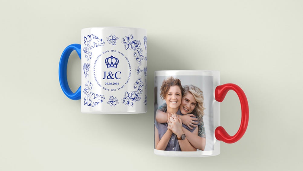 Two coffee mugs featuring different designs, one a photo and one a date, placed side by side on a wooden table.